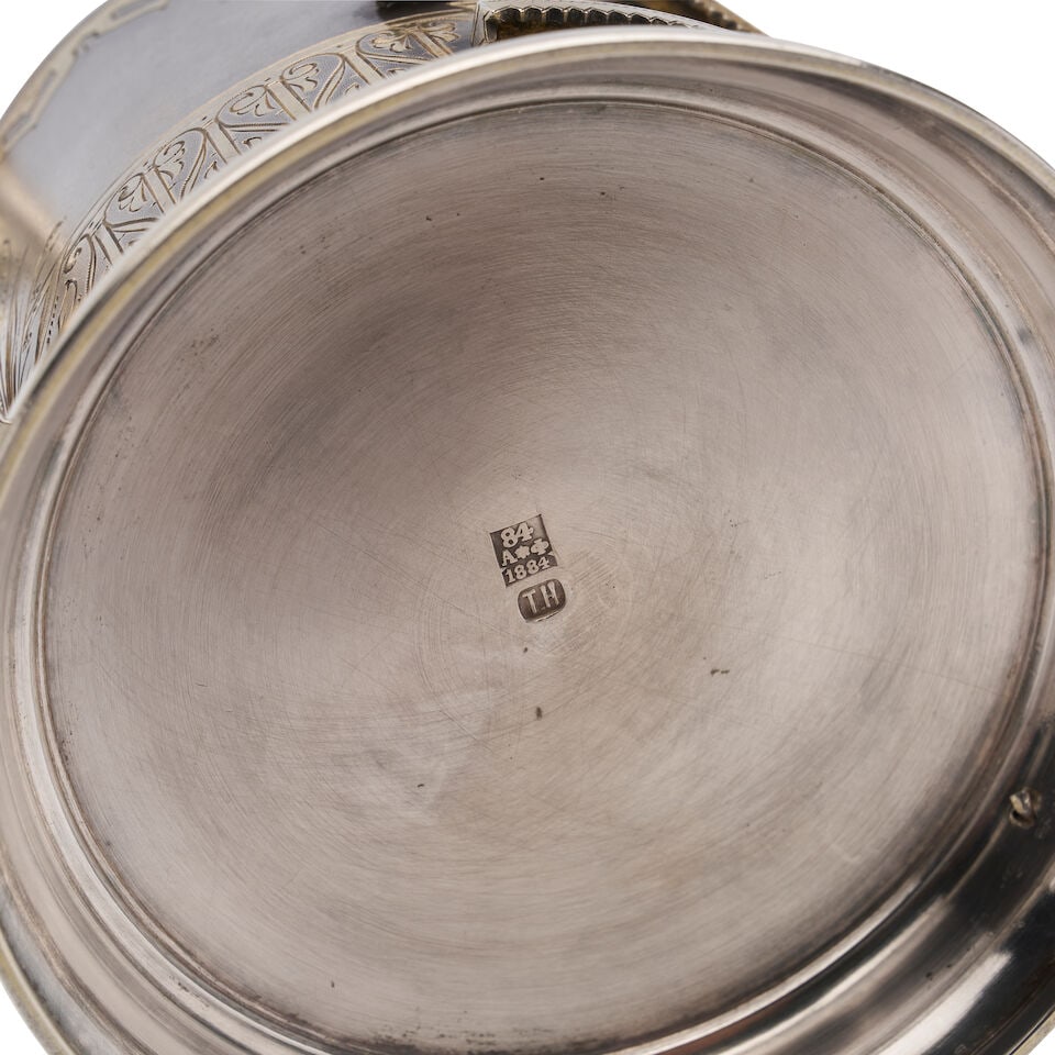 A PARCEL-GILT TEA GLASS HOLDER Unidentified assay master (TH), St Petersburg, 1884 - 2