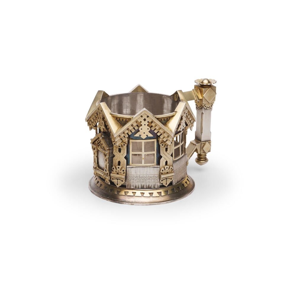 A RUSSIAN PARCEL-GILT TEA GLASS HOLDER Unidentified assay master (ИE possibly Ivan Evstign...: A RUSSIAN PARCEL-GILT TEA GLASS HOLDER Unidentified assay master (ИE possibly Ivan Evstigneev), St Petersburg, 1879 Russian Imperial mark 1879, 84 zolotniks, 875/1000 purity, the circular
