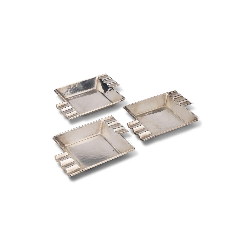 Three German 830 standard silver Bauhaus design ashtrays Marks of Gebrüder Kühn, Schwa...: Three German 830 standard silver Bauhaus design ashtrays Marks of Gebrüder Kühn, Schwabisch Gmünd, Germany, circa 1930, each deep square-shaped form with angular stepped rests at upper