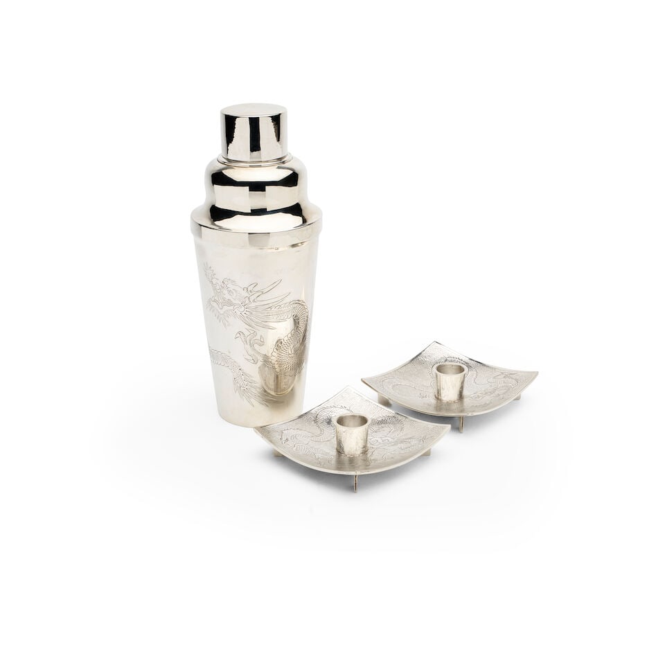 A Chinese export silver cocktail shaker and Hong Kong silver candlesticks,: A Chinese export silver cocktail shaker and Hong Kong silver candlesticks, both engraved with dragon designs, the cocktail shaker marked 90 Ren, the candlesticks marked Sammy SD 925 sterling, the