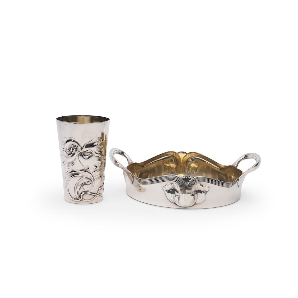 A German Jugendstil two-handled serving dish and beaker The dish marked H OAG C numbered 5295 an...: A German Jugendstil two-handled serving dish and beaker The dish marked H OAG C numbered 5295 and the beaker with marks of Gebrüder Kühn, Schwabisch Gmünd, circa 1900-1910 both in 800