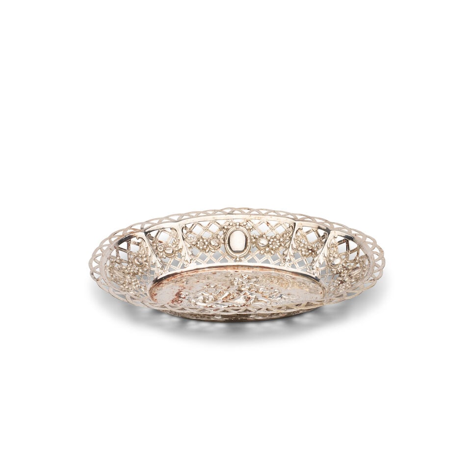 A German 800 standard silver openwork fruit basket Marks of Lazarus Posen, Frankfurt am Main, Ge...: A German 800 standard silver openwork fruit basket Marks of Lazarus Posen, Frankfurt am Main, Germany, stamped '2520' to the rim, circa 1900, oval shaped rim and pierced lattice borders with fruit