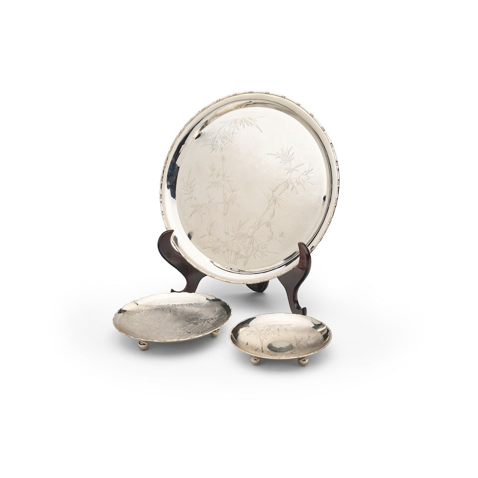 A Wai Kee Hong Kong sterling silver platter and two footed plates: A Wai Kee Hong Kong sterling silver platter and two footed plates all engraved with bamboo designs, the platter in original presentation box and larger footed plate both marked Wai Kee Hong Kong