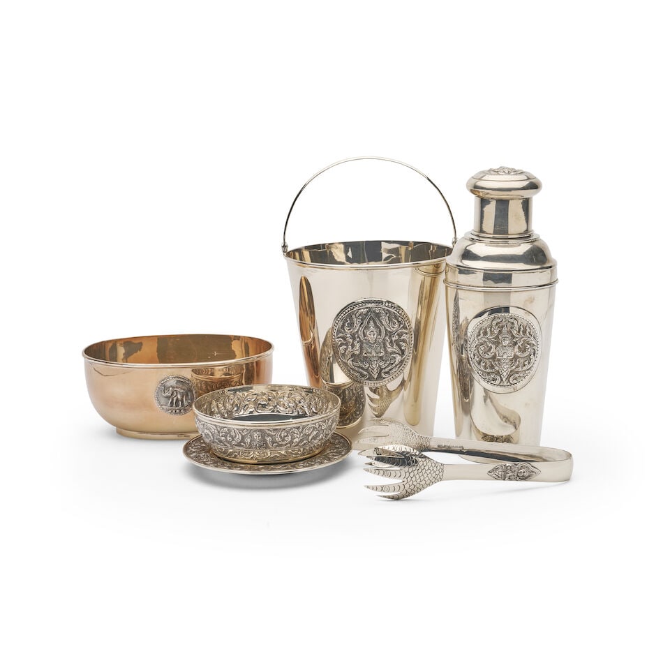 A group of Thai sterling silver barware (6): A group of Thai sterling silver barware comprising a cocktail shaker, ice bucket and tongs marked Siam Sterling 925, together with silver-gilt bowl with repousse elephant detail marked sterling 925, a