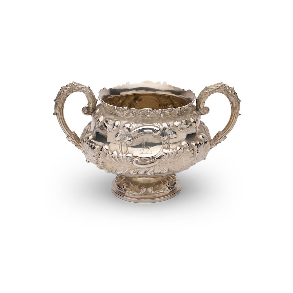 A George IV English silver two-handled sugar bowl Marks of Charles Fox II, London, 1824,: A George IV English silver two-handled sugar bowl Marks of Charles Fox II, London, 1824, Ornate repoussé work engraved with stag insignia, height 13.0cm, width across handles 21.0cm, weight 404 g