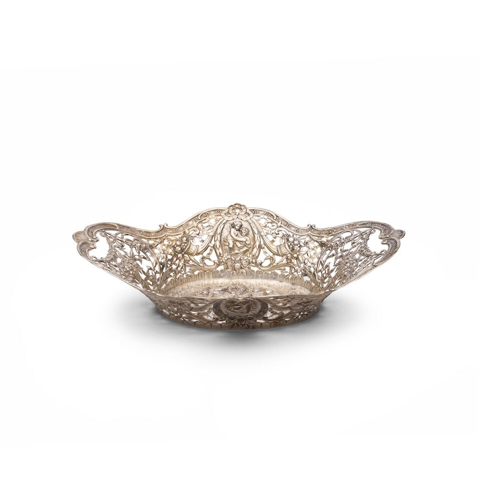 A German 800 standard silver-gilt openwork fruit basket Marks of Lazarus Posen, Frankfurt am Mai...: A German 800 standard silver-gilt openwork fruit basket Marks of Lazarus Posen, Frankfurt am Main, Germany circa 1900, shaped rim and pierced lattice borders with fruit and flowers, enclosing a