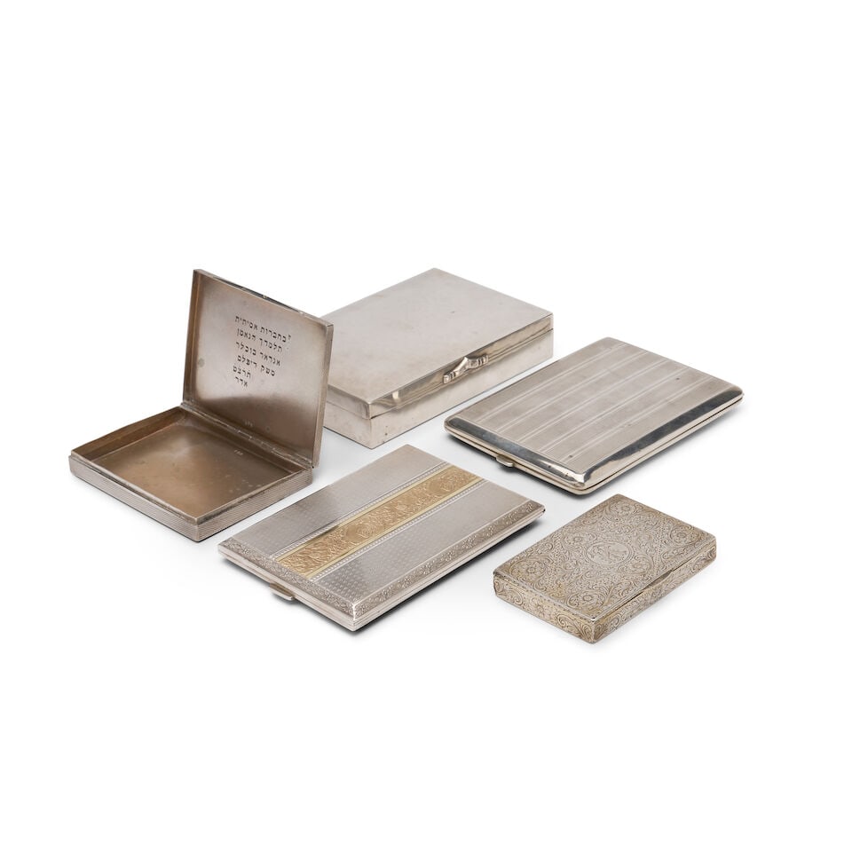 A group of five German silver cigarette, cigar and match cases Various makers, circa 1900 (5): A group of five German silver cigarette, cigar and match cases Various makers, circa 1900 including: A Rectangular matchbox with overall engraved filigree pattern and monogram initials TK, gilt interi
