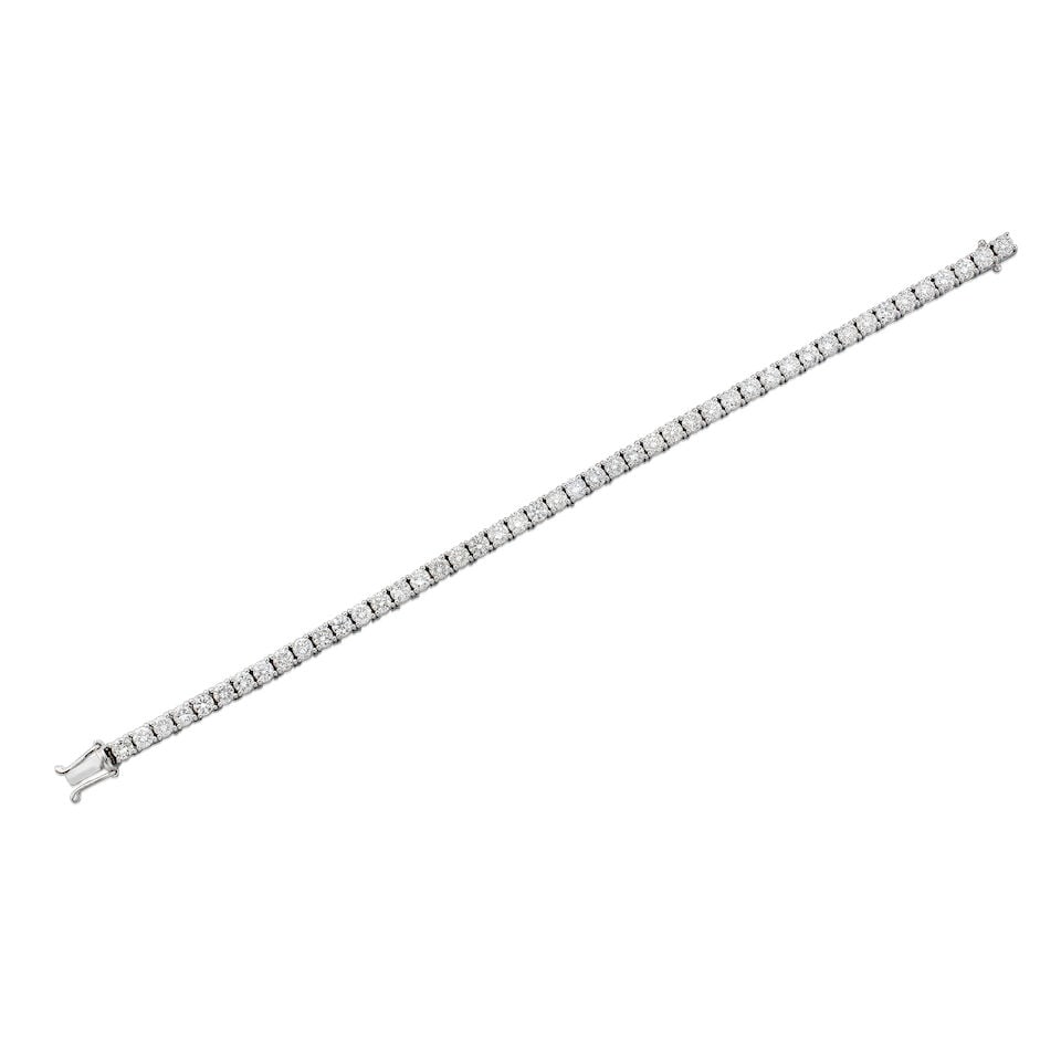 DIAMOND TENNIS BRACELET: DIAMOND TENNIS BRACELET 鑽石手鍊 Diamonds: 46pcs, stamped 5.85cts Metal: 18 karat white gold Length: 16.5cm Gross weight: 12.6g Footnotes: CONDITION REPORT In excellent
