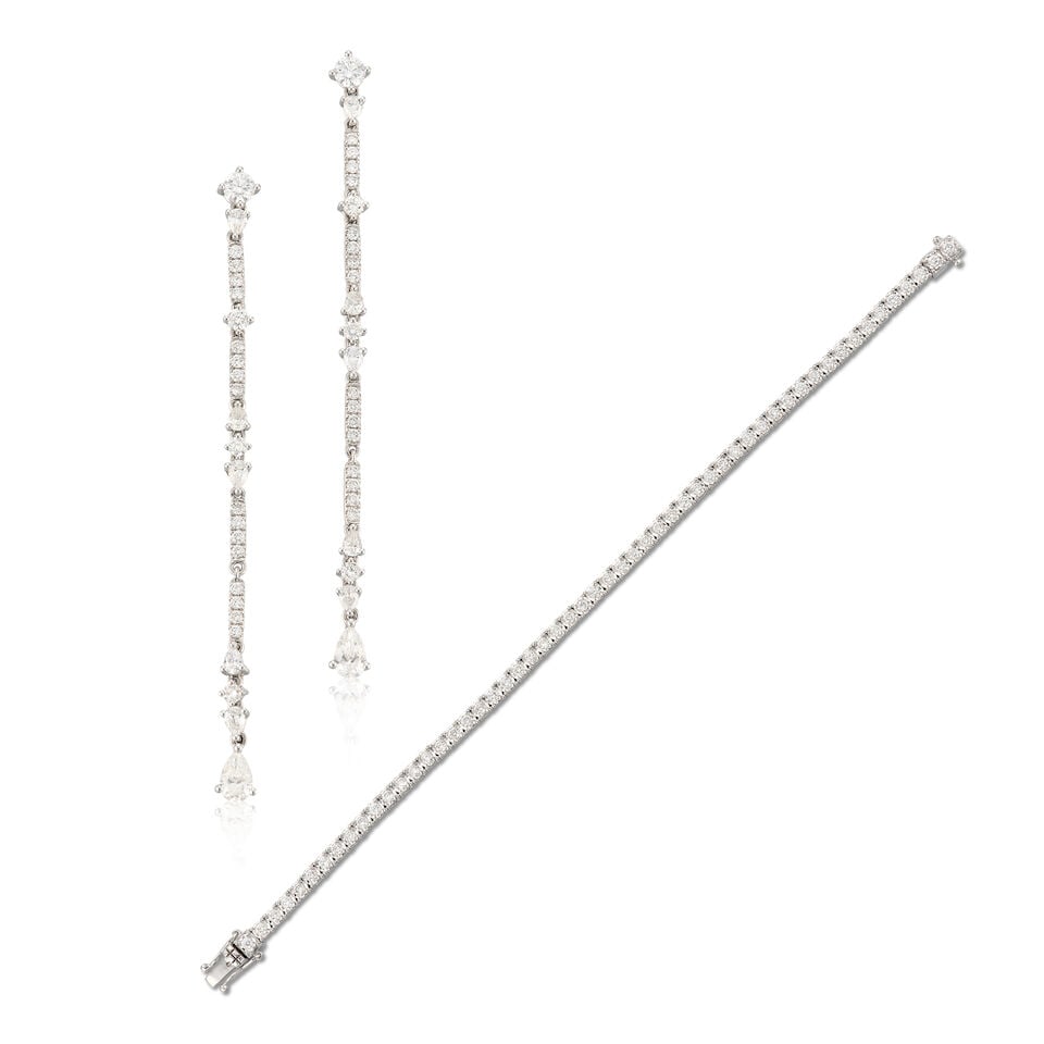 DIAMOND LINE BRACELET AND EARRINGS (2): DIAMOND LINE BRACELET AND EARRINGS 鑽石手鍊及耳環 Diamonds on bracelet: 55pcs, stamped 1.62cts Diamonds on earrings: stamped 2.387cts Metal: 18 karat white