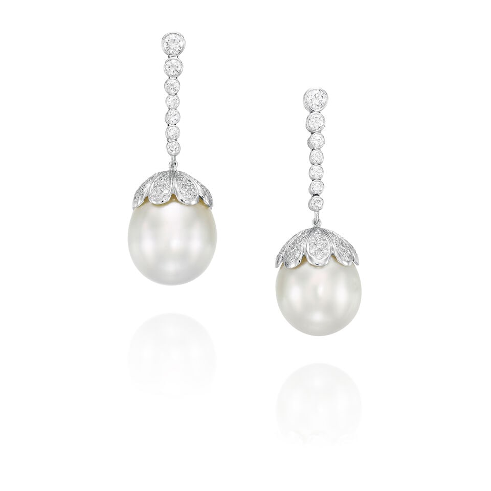 PAIR OF CULTURED PEARL AND DIAMOND PENDENT EARRINGS: PAIR OF CULTURED PEARL AND DIAMOND PENDENT EARRINGS 養殖珍珠配鑽石吊墜耳環 Cultured pearls: approx. 17.96 x 20.00mm and 17.35 x