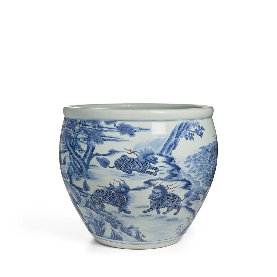 AN UNDERGLAZE-BLUE COPPER-RED 'MYTHICAL BEAST' JARDINIÈRE: AN UNDERGLAZE-BLUE COPPER-RED 'MYTHICAL BEAST' JARDINIÈRE 24in (61cm) diam; 21 7/8in (55.6cm)