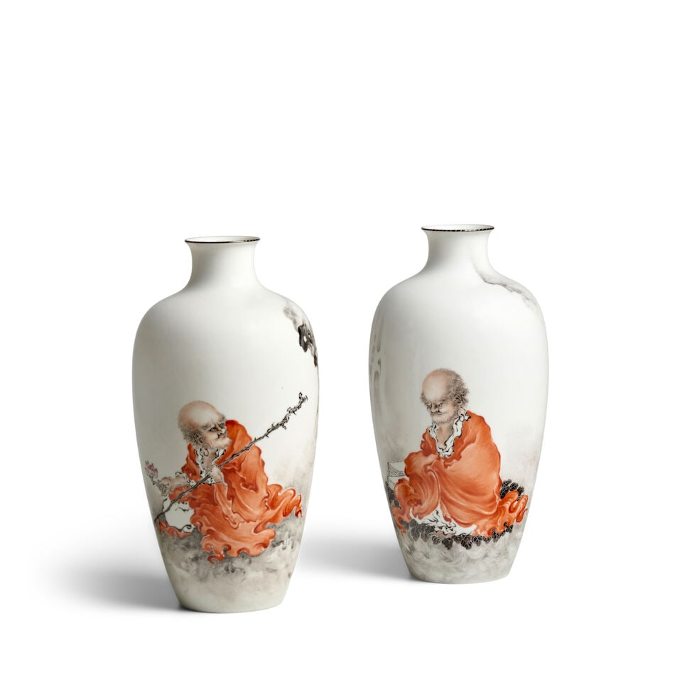 A PAIR OF INSCRIBED AND PAINTED ENAMEL 'LUOHAN' VASES Seals of Zhu Xi, Wang Bu, Chang Hu, 20th c...: A PAIR OF INSCRIBED AND PAINTED ENAMEL 'LUOHAN' VASES Seals of Zhu Xi, Wang Bu, Chang Hu, 20th century One vase depicting a Luohan holding a lotus blossom and a long staff, accompanied by four stylize