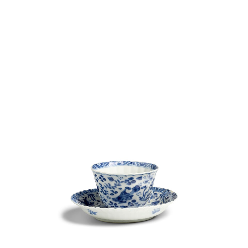 A BLUE AND WHITE 'FISH AND CRAB' CUP AND SAUCER DISH Kangxi period (2): A BLUE AND WHITE 'FISH AND CRAB' CUP AND SAUCER DISH Kangxi period The base of each with a canopy maker's mark in underglaze-blue within a double circle. Cup: 3 1/4in (8.3cm) diam; Saucer dish: 5in (1
