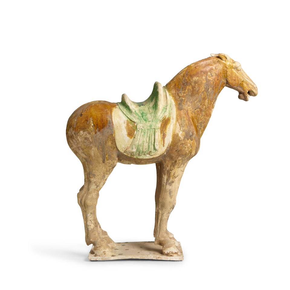 A PAINTED POTTERY FIGURE OF A HORSE Tang-style (1 of 3)