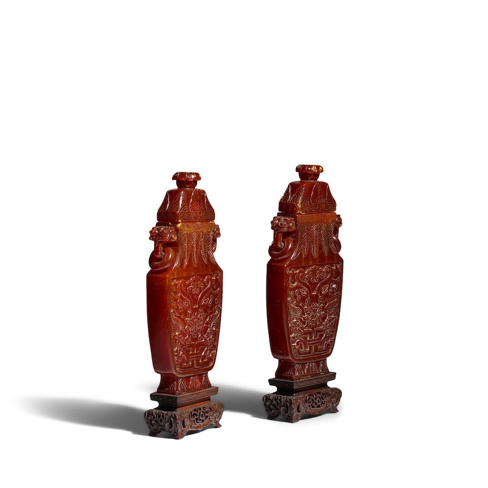 A PAIR OF CARVED AMBER 'TAOTIE MASK' VASES AND COVERS Qianlong/Jiaqing period (2, wood stands an... - 2