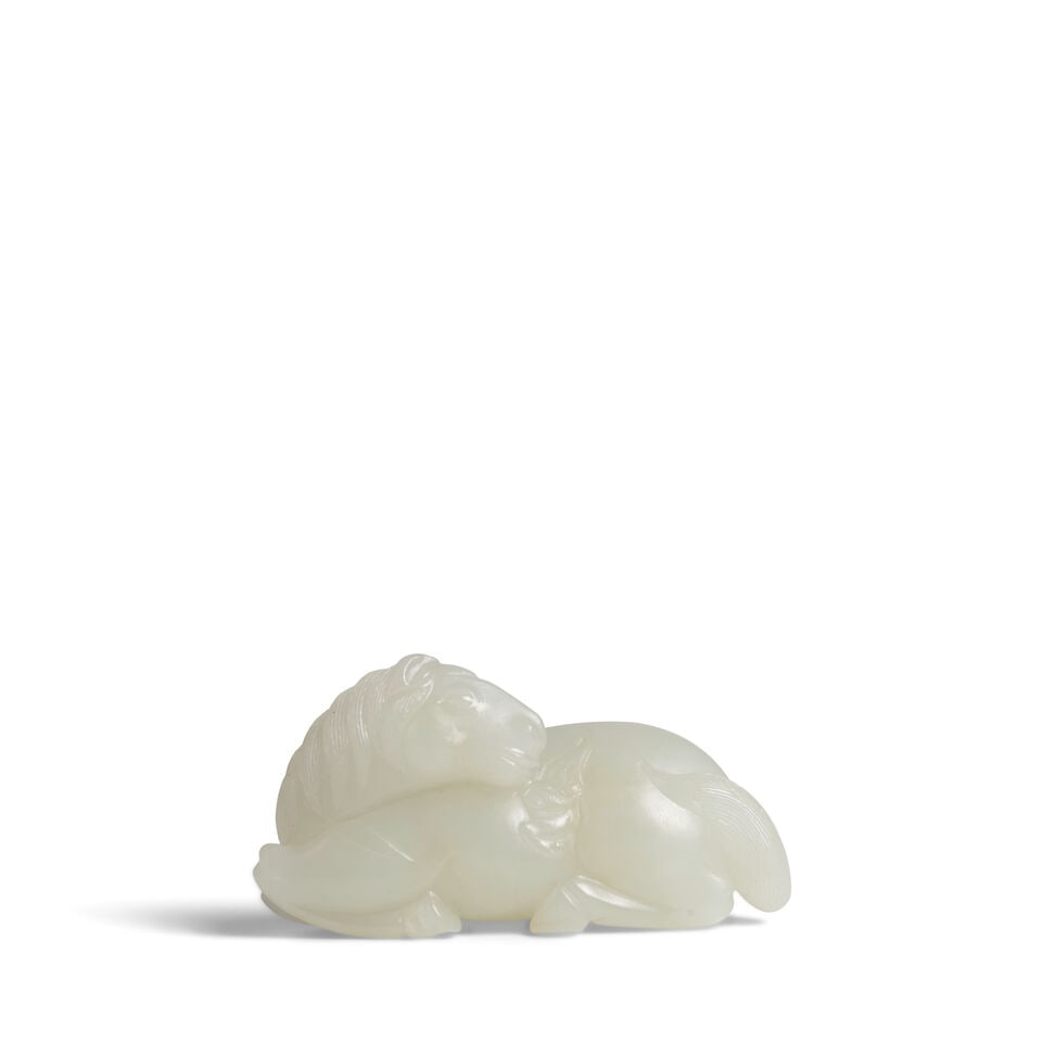 A WHITE JADE FIGURE OF A RECUMBENT HORSE Qing Dynasty: A WHITE JADE FIGURE OF A RECUMBENT HORSE Qing Dynasty 2 3/4in (7cm) Footnotes: 清 白玉雕馬擺件 For further information on this lot please visit Bonhams.com Fo