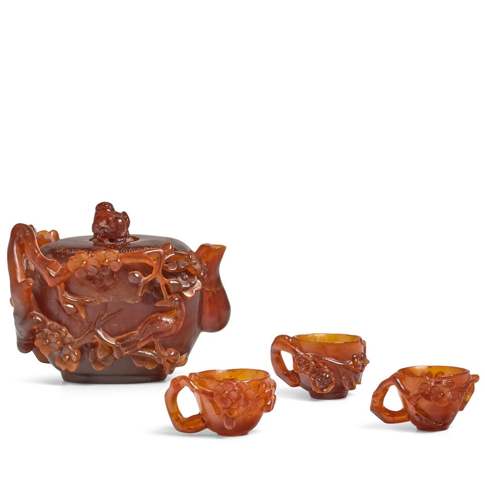 A GROUP OF FOUR AMBER CARVED 'PRUNUS' TEA VESSELS 19th century (4) (1 of 3)