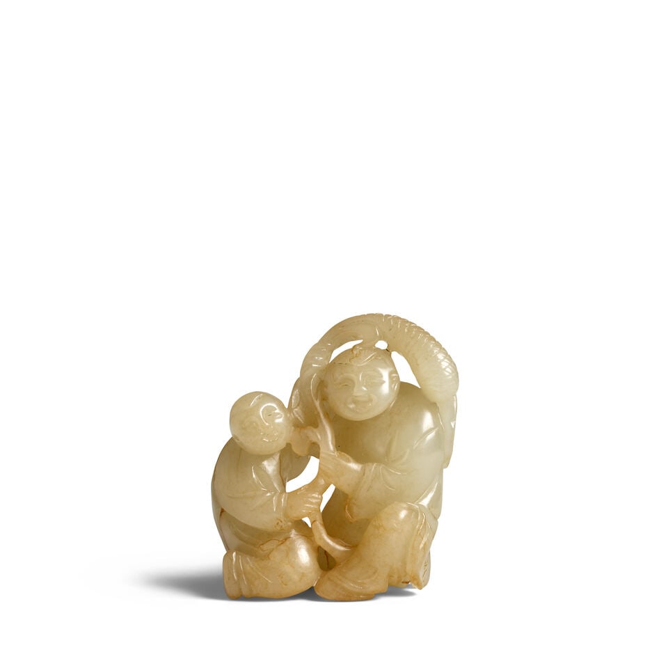 A CELADON JADE CARVING OF HEHE ERXIAN 19th century: A CELADON JADE CARVING OF HEHE ERXIAN 19th century 3in (7.5cm) high Footnotes: 十九世紀 青玉雕和合二仙擺件 For further inf