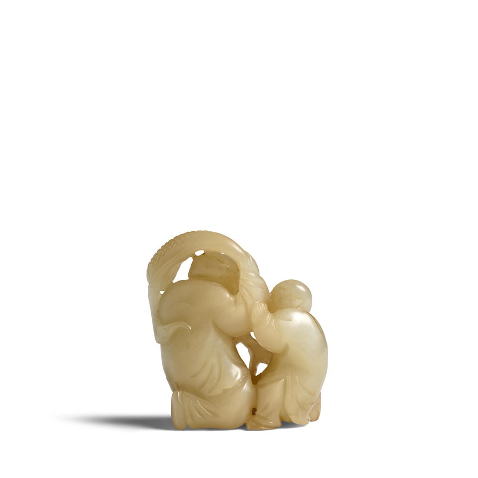 A CELADON JADE CARVING OF HEHE ERXIAN 19th century - 2
