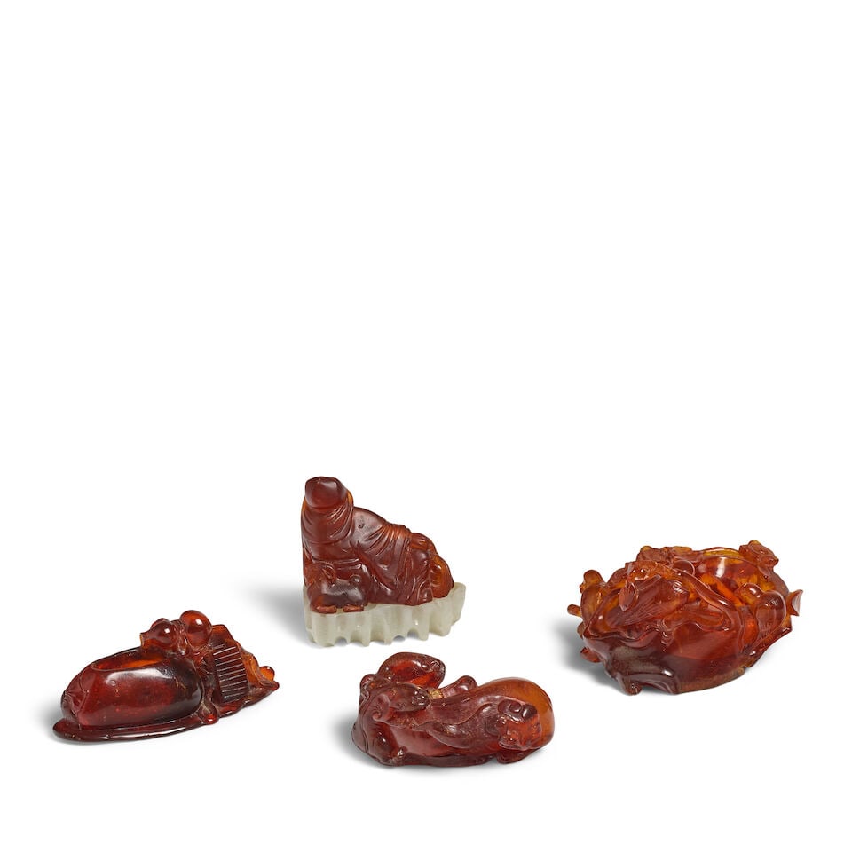 A GROUP OF FOUR AMBER CARVINGS 19th century (4, fitted hardstone stand for the Su Wu carving) - 2