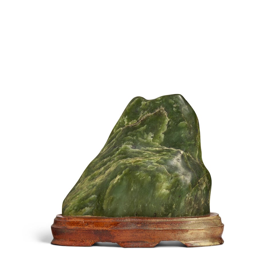 A SPINACH-GREEN JADE ROCK (wood stand) (1 of 3)