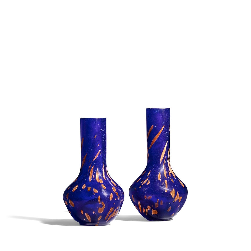 TWO GILT-FLECKED BLUE GLASS VASES 18th/19th century (2): TWO GILT-FLECKED BLUE GLASS VASES 18th/19th century The base of the shorter vase with an incised four-character Qianlong mark. 7in (17.7cm) and 7 5/8in (19.3cm) high (2). Footnotes: 十八/&