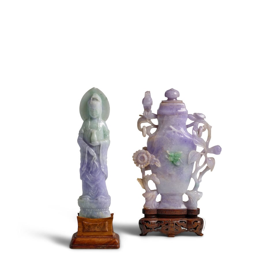 A LAVENDAR JADEITE VASE AND COVER Late Qing Dynasty (2, wood stands, guanyin affixed to wood stand): A LAVENDAR JADEITE VASE AND COVER Late Qing Dynasty Together with a 20th century lavender and green jadeite figure of guanyin. Vase: 6 7/8in (17.5cm) high; Guanyin: 7 1/4in (18.5cm) high (2, wood stan