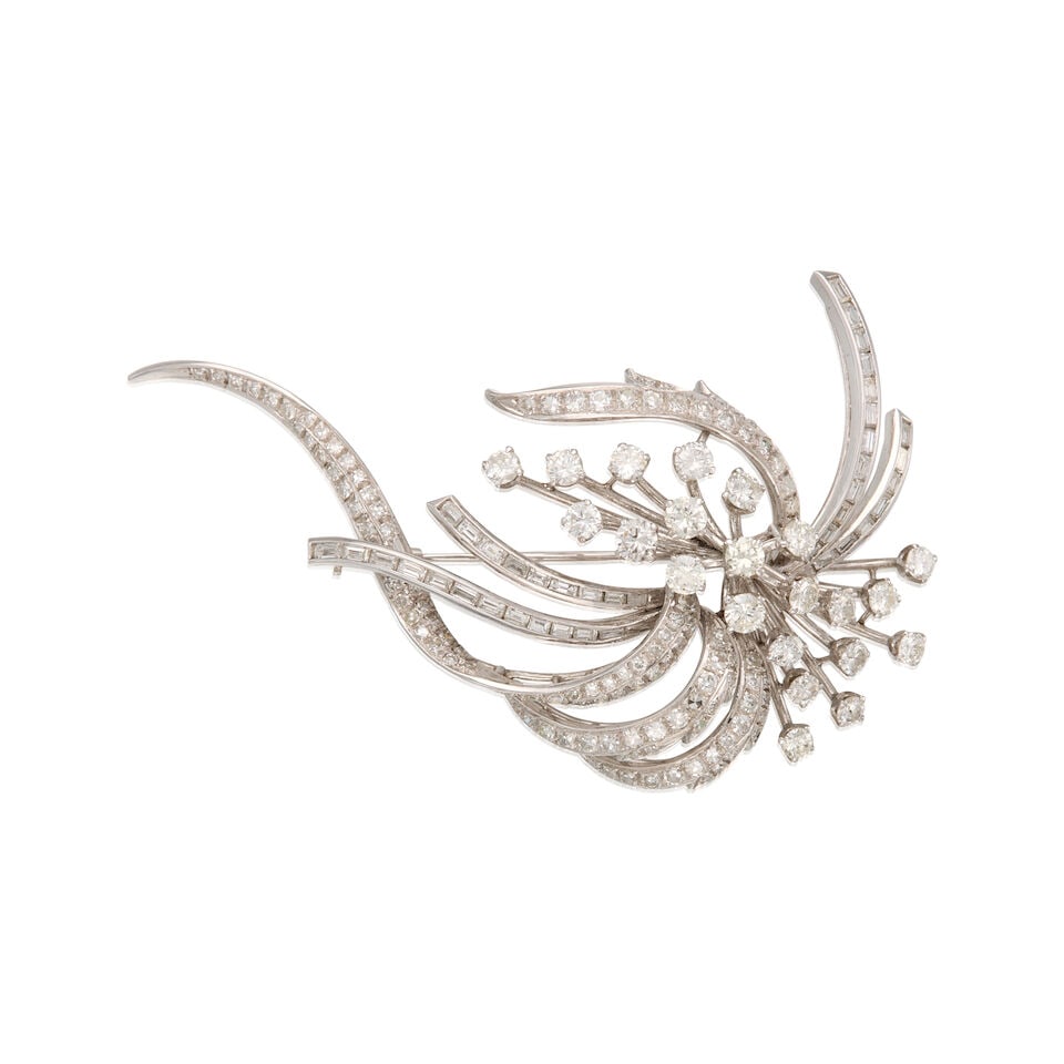 13K WHITE GOLD AND DIAMOND BROOCH: 13K WHITE GOLD AND DIAMOND BROOCH • Numerous rectangular shaped diamonds weighing approximately 0.70 carat total • Numerous round shaped diamonds weighing approximately 3.20 carats total