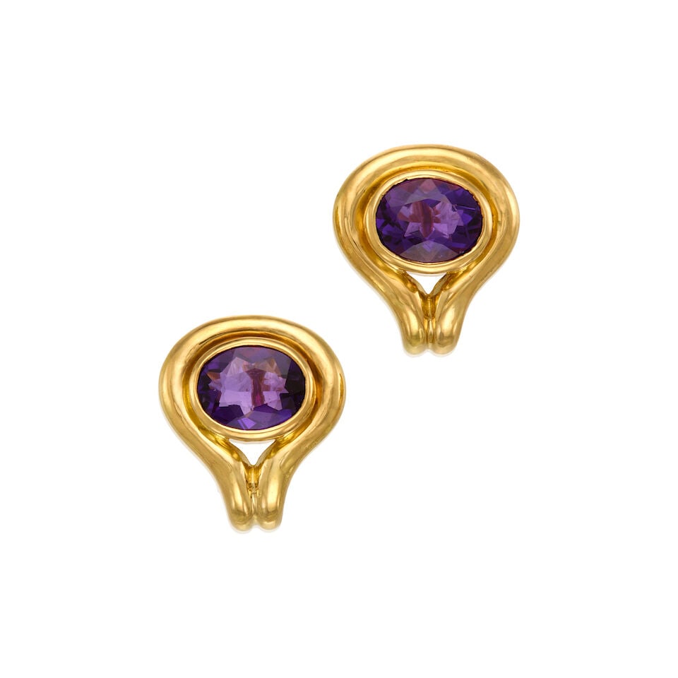 TIFFANY & CO.: 18K GOLD AND AMETHYST EARRINGS: TIFFANY & CO.: 18K GOLD AND AMETHYST EARRINGS • Two oval shaped amethyst weighing approximately 4.08 carats total • Stamped TIFFANY & CO. • Measures 3/4 in. x 5/8 in. • Estimat