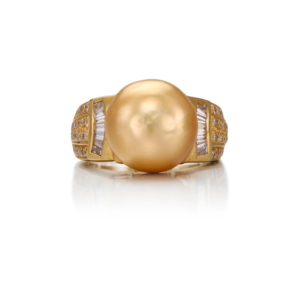 18K GOLD, CULTURED PEARL AND DIAMOND RING: 18K GOLD, CULTURED PEARL AND DIAMOND RING • One round cultured pearl measuring approximately 13.12mm in diameter • Fourteen tapered baguette diamonds weighing approximately 0.28 carat