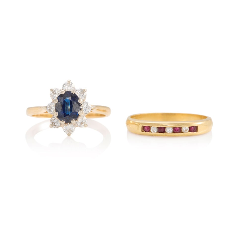 GOLD, SAPPHIRE, RUBY, AND DIAMOND RINGS: GOLD, SAPPHIRE, RUBY, AND DIAMOND RINGS • 14K and 16K white and yellow gold ring with an oval shaped sapphire weighing approximately 0.85 carat, with eight round brilliant cut diamonds weighing