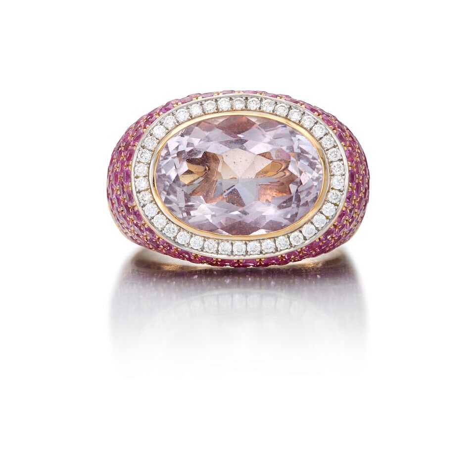 AL CORO: 18K GOLD, AMETHYST, PINK SAPPHIRE AND DIAMOND RING: AL CORO: 18K GOLD, AMETHYST, PINK SAPPHIRE AND DIAMOND RING • One oval shaped amethyst weighing approximately 6.58 carats total • Numerous round pink sapphires weighing approximately 6.20 