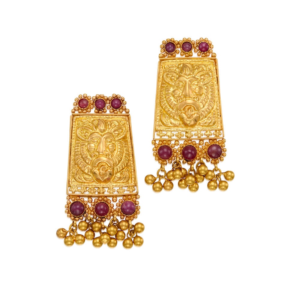 A GOLD AND RUBY EARRINGS: A GOLD AND RUBY EARRINGS • 21K gold and 14K gold • Twelve round cabochon shaped rubies measuring approximately 3.63mm to 5.08mm in diameter • Measures 2 in. x 1 in. •