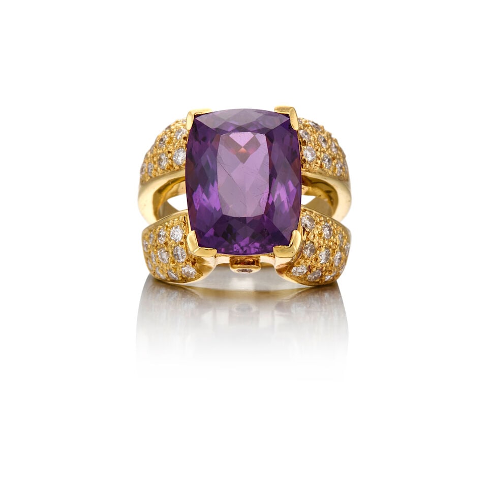 17K GOLD, AMETHYST AND DIAMOND RING: 17K GOLD, AMETHYST AND DIAMOND RING • One rectangular shaped amethyst weighing approximately 9.69 carats total • Forty-six round brilliant cut diamonds weighing approximately 0.92 carat