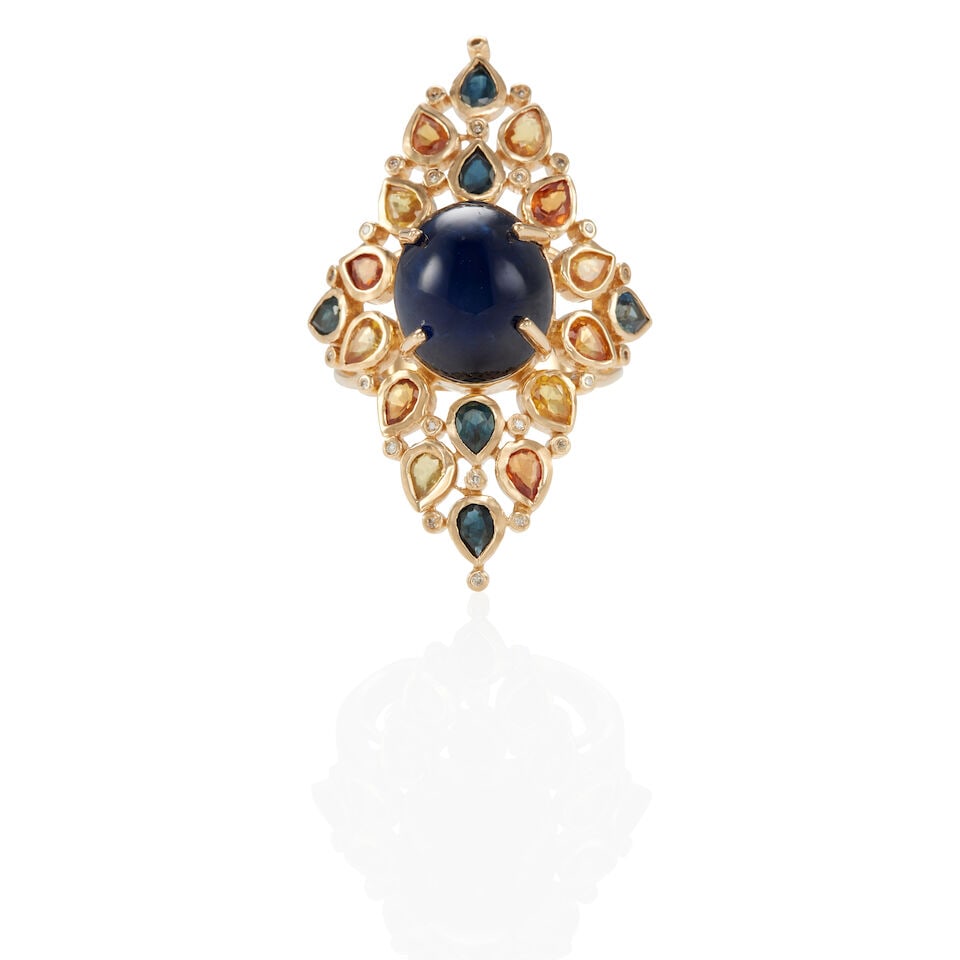 14K YELLOW GOLD, SAPPHIRE, AND DIAMOND RING: 14K YELLOW GOLD, SAPPHIRE, AND DIAMOND RING • One oval cabochon sapphire weighing approximately 10.32 carats (13.76 x 11.39 x 6.03 mm) • Eighteen pear shaped sapphires weighing approximate