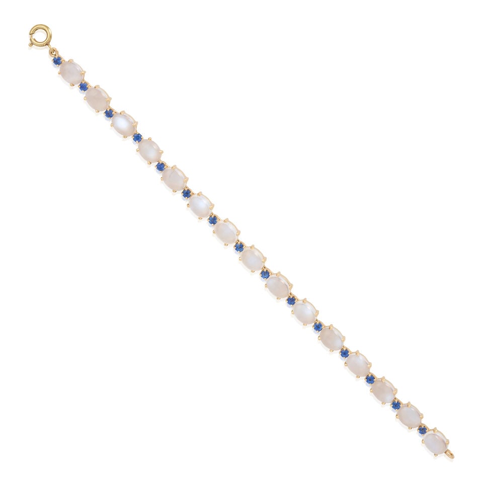 14K YELLOW GOLD, MOONSTONE, AND SAPPHIRE BRACELET: 14K YELLOW GOLD, MOONSTONE, AND SAPPHIRE BRACELET • Numerous cabochon moonstones weighing approximately 16 carats total • Numerous round shaped sapphires weighing approximately 0.60