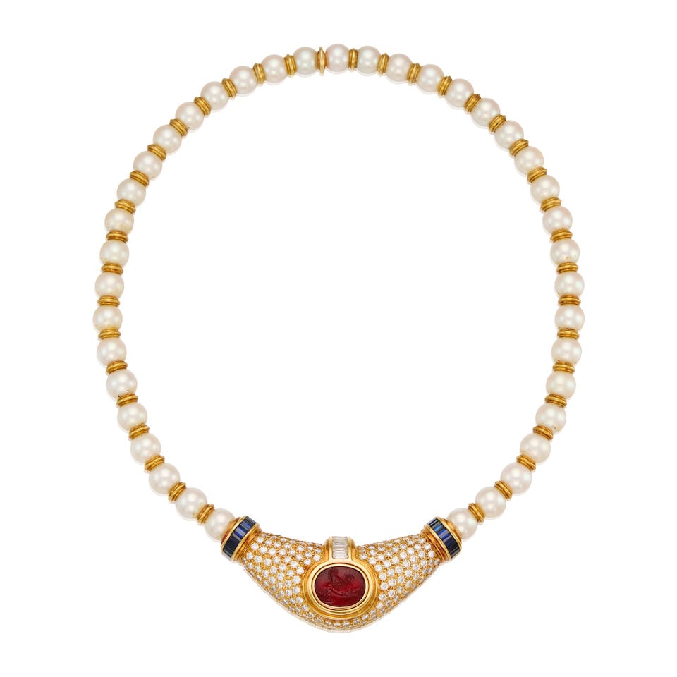 18K GOLD, CULTURED PEARL, CARNELIAN INTAGLIO, DIAMOND AND SAPPHIRE NECKLACE: 18K GOLD, CULTURED PEARL, CARNELIAN INTAGLIO, DIAMOND AND SAPPHIRE NECKLACE • Thirty-nine round and drilled cultured pearls measuring approximately 7.66mm in diameter • One carved