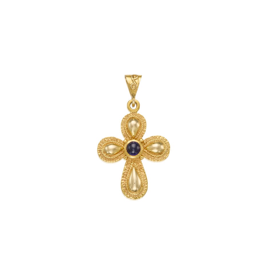 14K GOLD AND SYNTHETIC SAPPHIRE PENDANT: 14K GOLD AND SYNTHETIC SAPPHIRE PENDANT • One round cabochon shaped synthetic sapphire measuring approximately 4.31mm in diameter • Measures 1 1/2 in. x 1/2 in. • Estimated gross