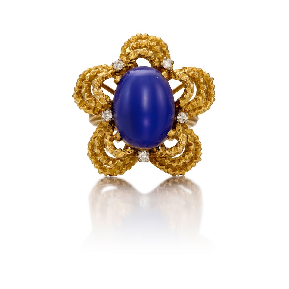 18K GOLD, DYED CHALCEDONY AND DIAMOND RING: 18K GOLD, DYED CHALCEDONY AND DIAMOND RING • One oval cabochon shaped dyed chalcedony measuring approximately 15.90mm x 11.84mm • Five round brilliant cut diamonds weighing approximately