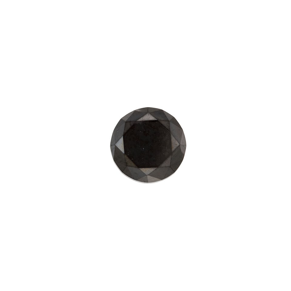 A LOOSE BLACK DIAMOND: A LOOSE BLACK DIAMOND • A round brilliant cut diamond weighing approximately 10.17 carats • Measures 13.05mm x 13.09mm x 8.90mm Footnotes: Diamonds untested for origin of color. OVERALL