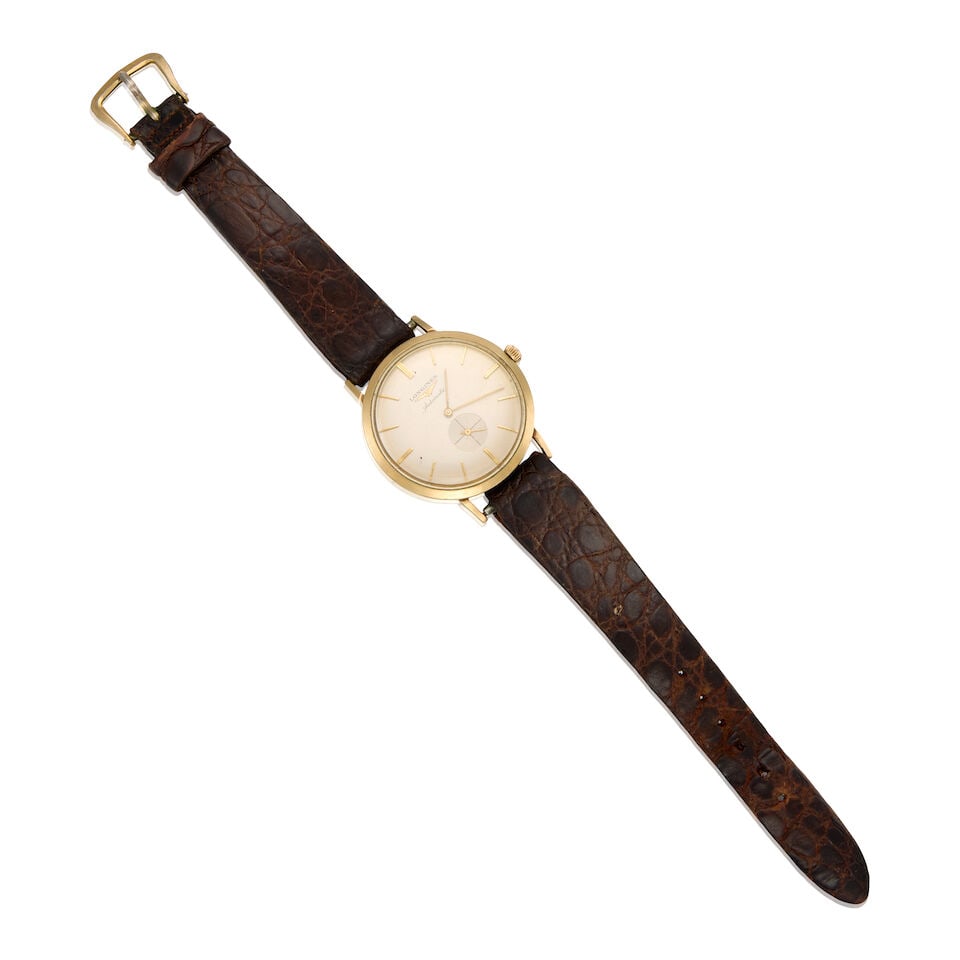 LONGINES: 10K GOLD WATCH WITH LEATHER STRAP: LONGINES: 10K GOLD WATCH WITH LEATHER STRAP • 10K gold watch case and brown leather bracelet • Signed LONGINES on the dial • Automatic movement currently not running • Personal