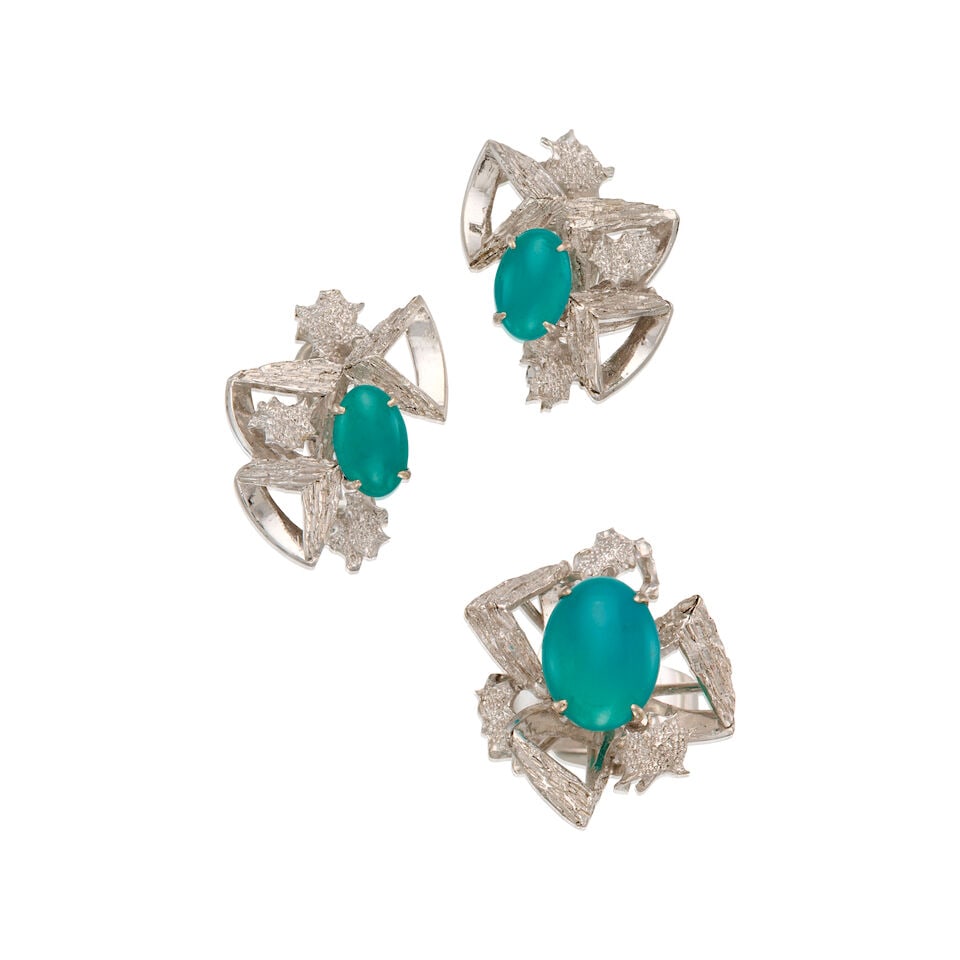 A WHITE GOLD, GEM SILICA EARRINGS AND RING: A WHITE GOLD, GEM SILICA EARRINGS AND RING • A pair of 10K white gold and nickel-based metal earrings with two oval cabochon shaped gem silica measuring approximately 9.48mm x 6.28mm, measures