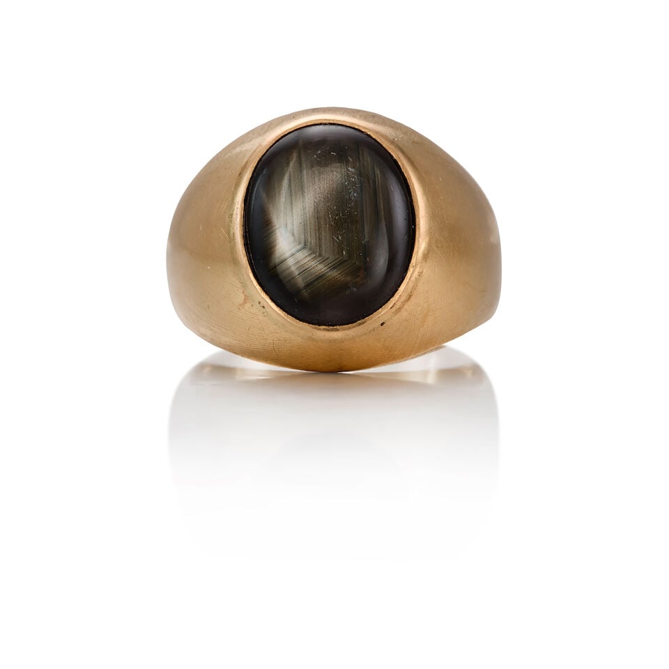 14K STAR SAPPHIRE RING: 14K STAR SAPPHIRE RING • One oval cabochon shaped sapphire measuring approximately 13.21mm x 10.90mm • Size 9 • Estimated gross weight: 11.0 grams Footnotes: OVERALL CONDITION: