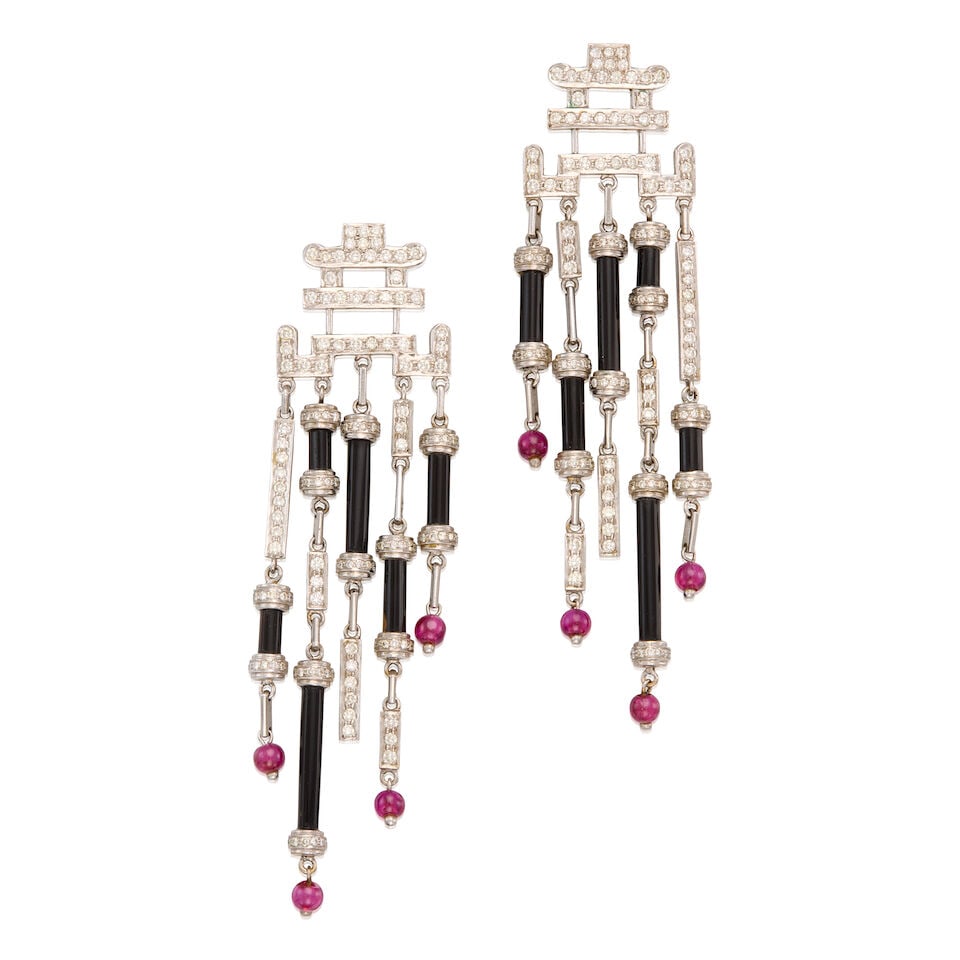 18K WHITE GOLD, DIAMOND, RUBY AND ONYX EARRINGS: 18K WHITE GOLD, DIAMOND, RUBY AND ONYX EARRINGS • Numerous round brilliant cut diamonds weighing approximately 4.08 carats total • Eight round and drilled ruby beads measuring
