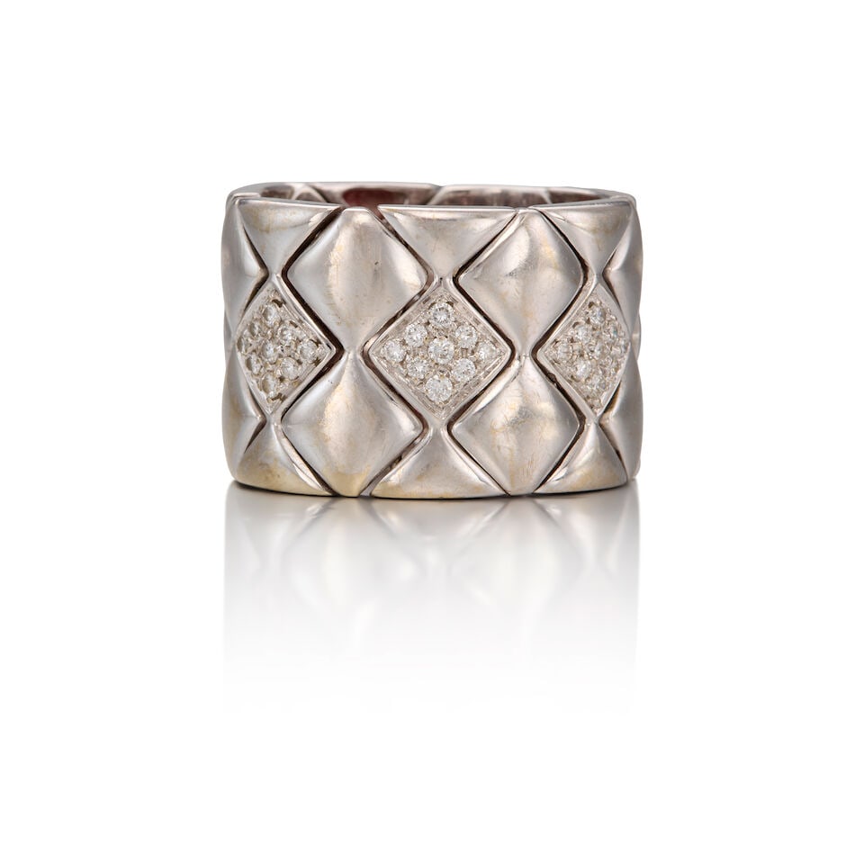 18K WHITE GOLD AND DIAMOND RING BAND: 18K WHITE GOLD AND DIAMOND RING BAND • Twenty-seven round brilliant cut diamonds weighing approximately 0.27 carat total • Size 7 3/4 • Estimated gross weight: 20.30