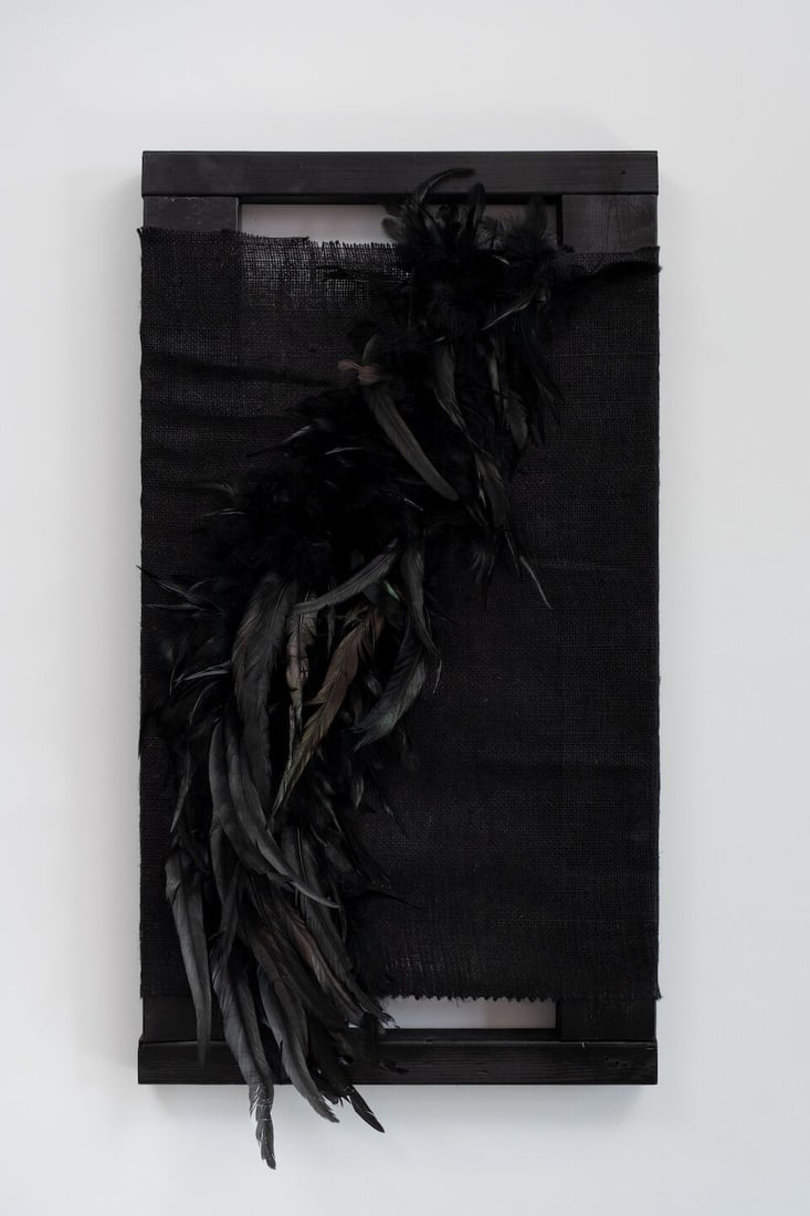 XAVIER LEOPOLD (B. 1992) Etheral Obsidian (Executed in 2026): XAVIER LEOPOLD (B. 1992) Etheral Obsidian feathers, acrylic paint, hessian on found wood 96 x 51cm (37 3/4 x 20in). Executed in 2026 Footnotes: Provenance Donated by the artist Image © Damian
