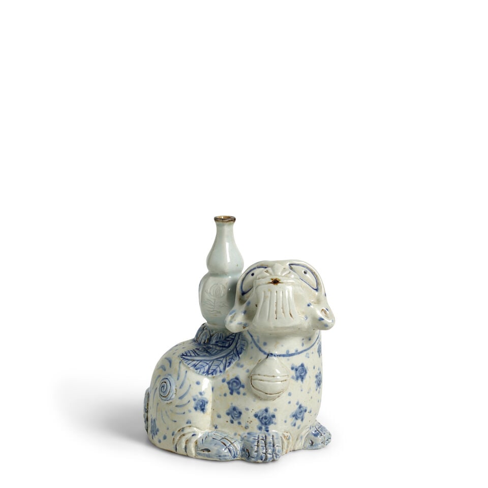 A Large Porcelain Blue and White 'Haetae' Water Dropper Korea, 19th century,: A Large Porcelain Blue and White 'Haetae' Water Dropper Korea, 19th century, Modeled as the lion-like creature in crouched position 7 1/4in (18.4cm) high For further information on this lot please