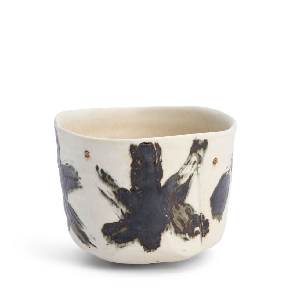 A White-glazed Tea Bowl 20th century,: A White-glazed Tea Bowl 20th century, With black painted calligraphic inscription 3 5/8in (9.2cm) high Lot to be sold without reserve. This lot is subject to the following lot symbols: ¤ ¤