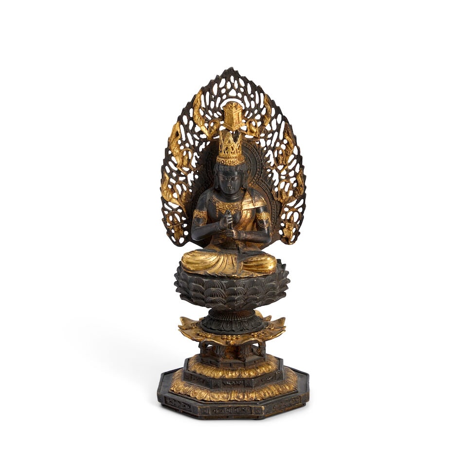 A Gilt Bronze Figure of Dainichi Nyorai Japan, Edo period (1615-1868) or Meiji era (1868-1912), ...: A Gilt Bronze Figure of Dainichi Nyorai Japan, Edo period (1615-1868) or Meiji era (1868-1912), 19th century, Depicted seated on a lotus pedestal base, with an openwork mandorla 10 1/4in (26cm) high F
