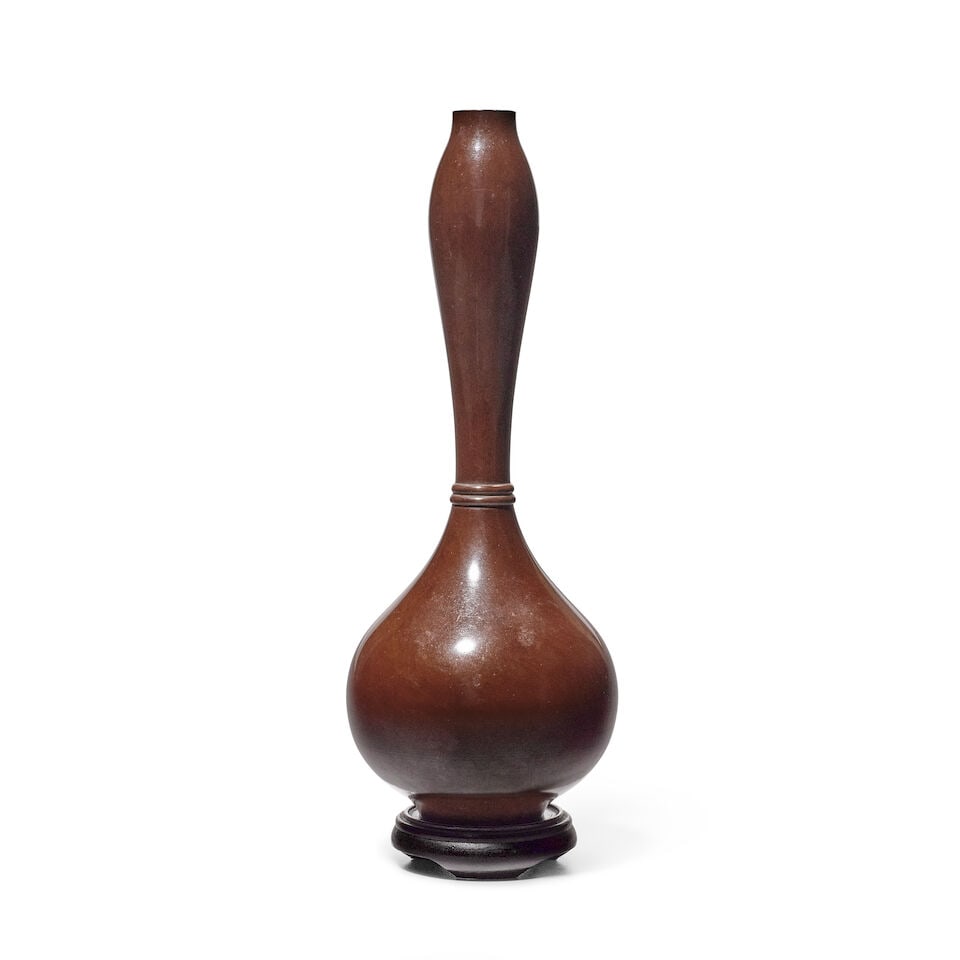 A Bronze Flower Vase Japan, Showa era (1926-1989) era, 20th century,: A Bronze Flower Vase Japan, Showa era (1926-1989) era, 20th century, Of bronze cast in double-gourd shape with two rings around the waist, patinated to a dark brown color With a wood tomobako storage 